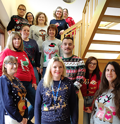 Wider Plan staff wearing Christmas jumpers
